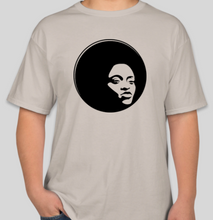 Load image into Gallery viewer, The Politicrat Daily Podcast Afro Black Woman unisex t-shirt in sand