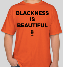 Load image into Gallery viewer, The Politicrat Daily Podcast Blackness Is Beautiful unisex orange t-shirt

