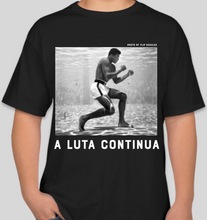 Load image into Gallery viewer, The Politicrat Daily Podcast A Luta Continua Series Muhammad Ali black t-shirt
