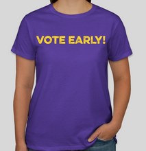 Load image into Gallery viewer, This purple The Politicrat Vote Early! Hanes 100% preshrunk cotton tagless t-shirt for women will have you looking great and sending an important message about the need to vote early this election year. Look sharp and colorful and VOTE EARLY! Purple with yellow print and logo on the back. Available in Large and Medium.
